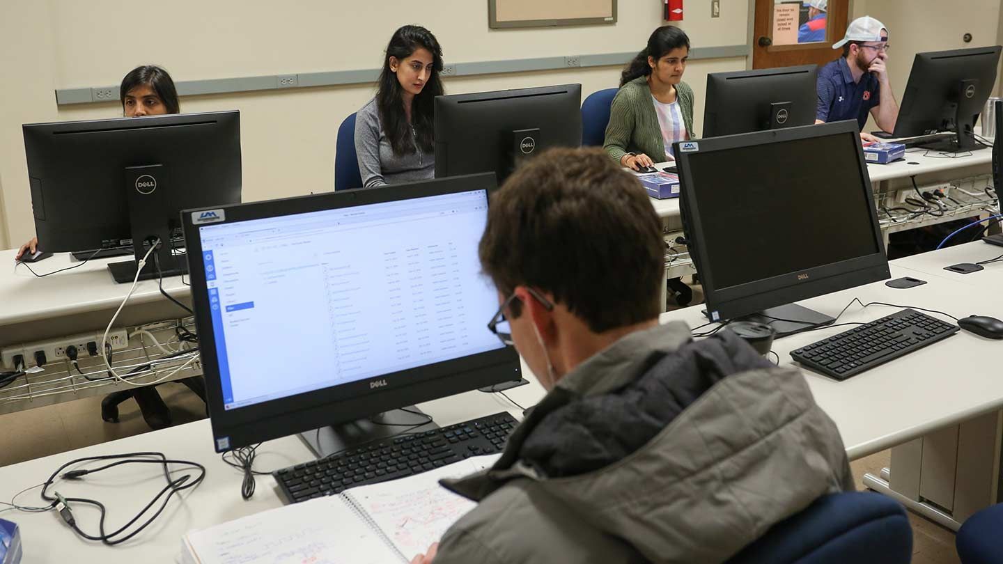 students in class on computers